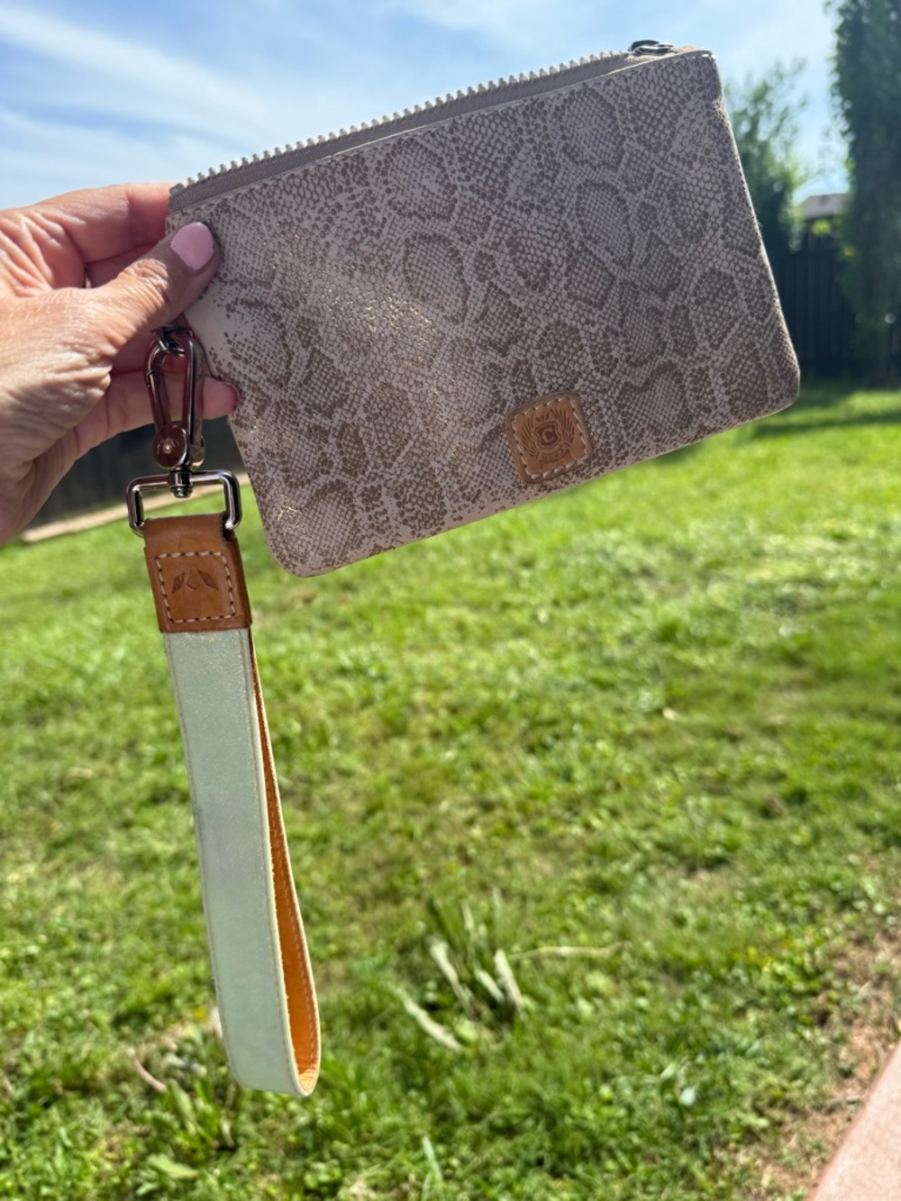 Consuela beige snake-print wristlet with tan trim